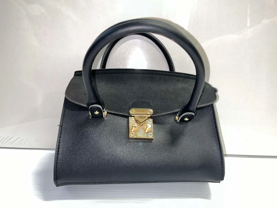 Black hand purse with gold clasp