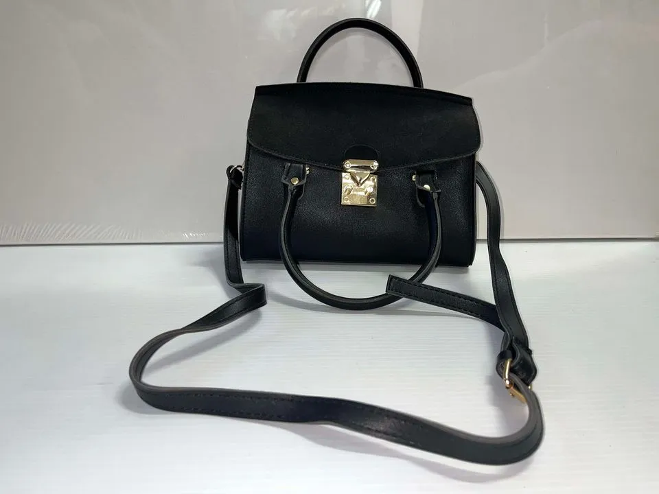 Black hand purse with gold clasp