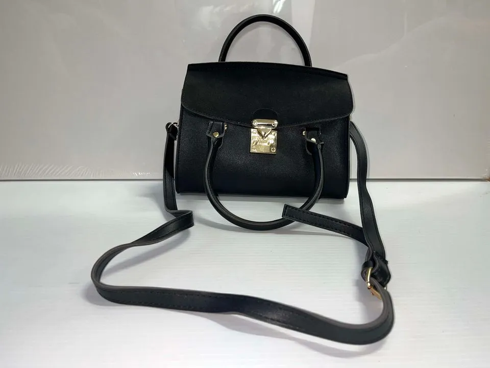 Black hand purse with gold clasp